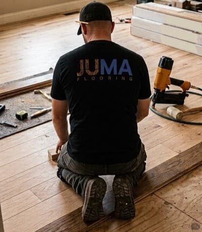 A JUMA Flooring Co worker doing a flooring installation at a residence in San Diego